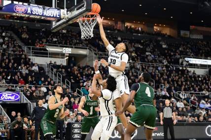 Nov 28, 2023; Providence, Rhode Island, USA; Providence Friars forward Rafael Castro (30) goes for a lay up against the Wagner Seahawks during the first half at Amica Mutual Pavilion. Mandatory Credit: Eric Canha-USA TODAY Sports