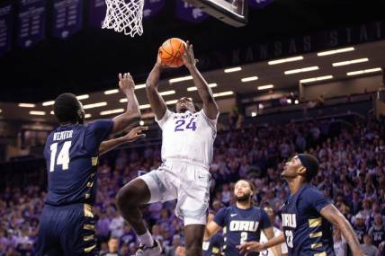 Kansas State junior transfer wing Arthur Kaluma (24) looks for a layup against Oral Roberts during the first half of Tuesday's game inside Bramlage Coliseum.