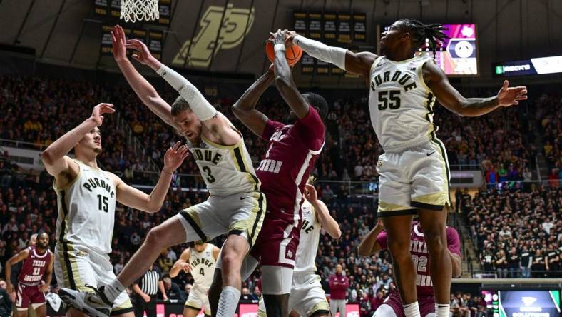 Nov 28, 2023; West Lafayette, Indiana, USA; Purdue Boilermakers guard Lance Jones (55) blocks a shot by Texas Southern Tigers forward Jahmar Young Jr. (2) during the first half at Mackey Arena. Mandatory Credit: Marc Lebryk-USA TODAY Sports