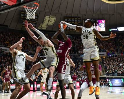 Nov 28, 2023; West Lafayette, Indiana, USA; Purdue Boilermakers guard Lance Jones (55) blocks a shot by Texas Southern Tigers forward Jahmar Young Jr. (2) during the first half at Mackey Arena. Mandatory Credit: Marc Lebryk-USA TODAY Sports