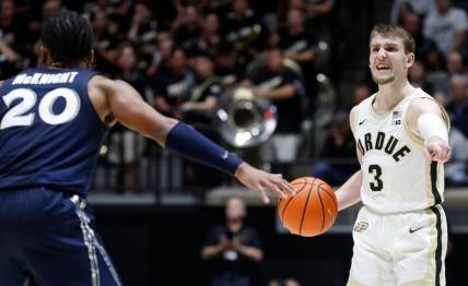 Xavier Musketeers guard Dayvion McKnight (20) defends Purdue Boilermakers guard Braden Smith (3) during the NCAA men   s basketball game, Monday, Nov. 13, 2023, at Mackey Arena in West Lafayette, Ind. Purdue Boilermakers won 83-71.