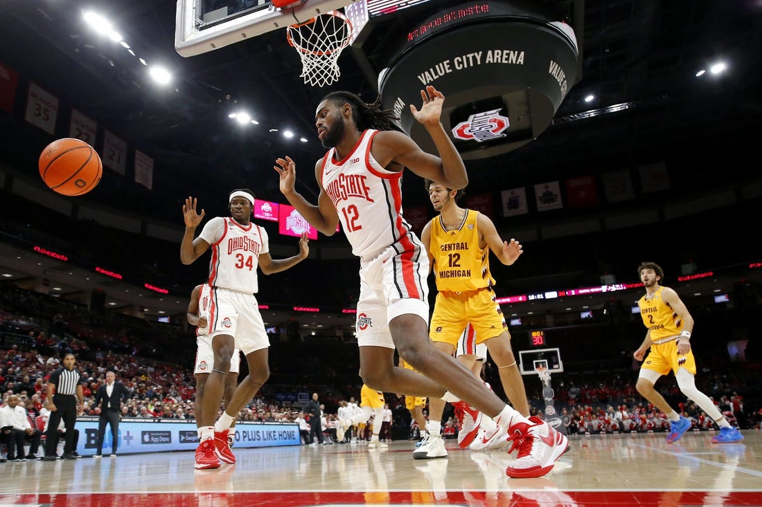 Nov 29, 2023; Columbus, Ohio, USA; Ohio State Buckeyes center Felix Okpara (34) and guard Evan Mahaffey (12) blocks the shot of Central Michigan Chippewas center Hunter Harding (12) during the first half at Value City Arena. Mandatory Credit: Joseph Maiorana-USA TODAY Sports