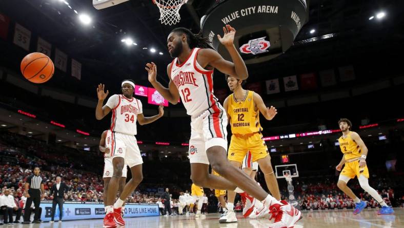 Nov 29, 2023; Columbus, Ohio, USA; Ohio State Buckeyes center Felix Okpara (34) and guard Evan Mahaffey (12) blocks the shot of Central Michigan Chippewas center Hunter Harding (12) during the first half at Value City Arena. Mandatory Credit: Joseph Maiorana-USA TODAY Sports