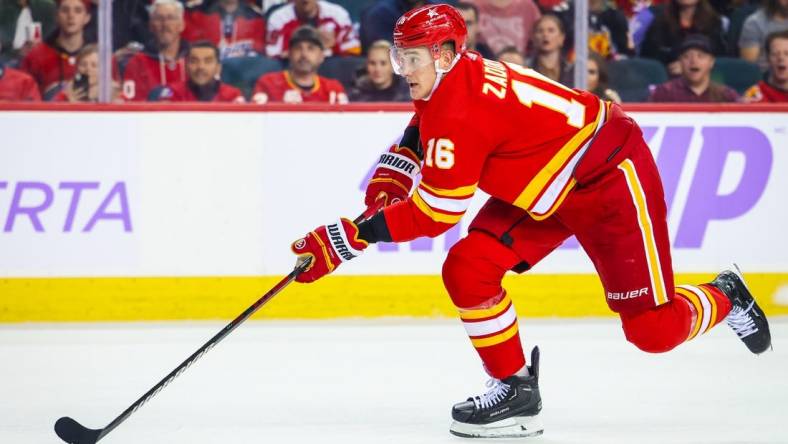 Nov 27, 2023; Calgary, Alberta, CAN; Calgary Flames defenseman Nikita Zadorov (16) skates with the puck against the Vegas Golden Knights during the second period at Scotiabank Saddledome. Mandatory Credit: Sergei Belski-USA TODAY Sports