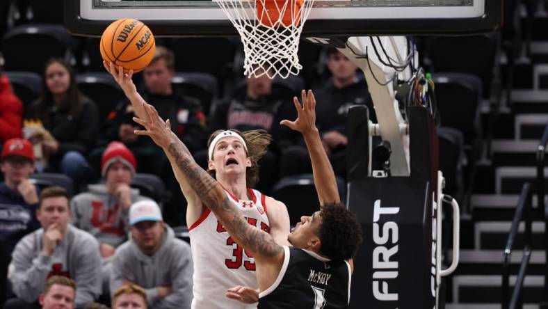 Nov 30, 2023; Salt Lake City, Utah, USA; Utah Utes center Branden Carlson (35) shoots the ball over Hawaii Warriors forward Justin McKoy (1) during the first half at Delta Center. Mandatory Credit: Rob Gray-USA TODAY Sports