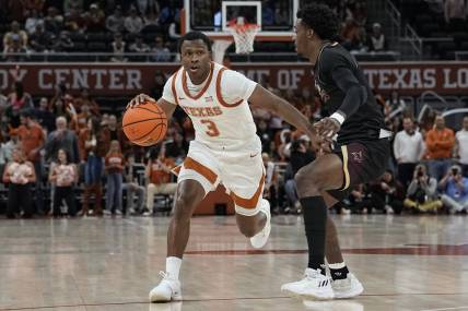 Nov 30, 2023; Austin, Texas, USA; Texas Longhorns 
guard Max Abmas (3) looks to pass the ball while defended by Texas State Bobcats guard Dylan Dawson (0) during the second half at Moody Center. Mandatory Credit: Scott Wachter-USA TODAY Sports