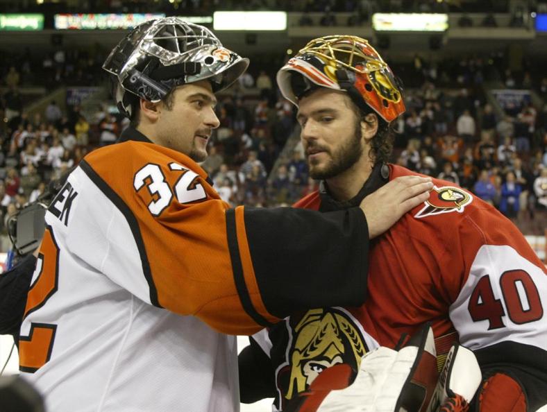 Ottawa Senators goalie Patrick Lalime (R) is congratulated by Philadelphia Flyers goalie Roman Cechmanek after the Senators won the NHL Eastern conference semi-finals at First Union Center in Philadelphia, May 5, 2003. Ottawa defeated Philadelphia 5-1, and won the series four games to two.