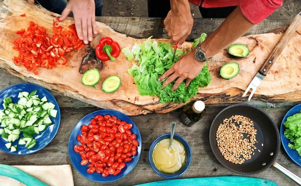 Food being prepped on wooden cutting board