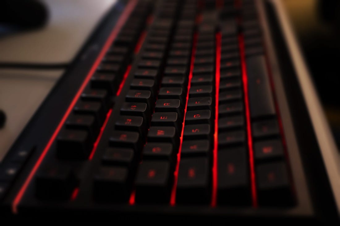 A custom gaming keyboard backlit with red LED lights waits for tactile input before Manual took on Boone County in a Rocket League match, which was streamed on YouTube on Thursday, March 5, 2020.