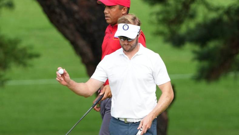 Jul 30, 2021; Tokyo, Japan; Kalle Samooja (FIN) reacts after putting on the second green during round two of the men's individual stroke play of the Tokyo 2020 Olympic Summer Games at Kasumigaseki Country Club. Mandatory Credit: Kyle Terada-USA TODAY Sports