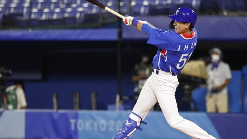 Jul 31, 2021; Yokohama, Japan; Team South Korea outfielder Jung Hoo Lee (51) hits a single against USA during the Tokyo 2020 Olympic Summer Games at Yokohama Baseball Stadium. Mandatory Credit: Yukihito Taguchi-USA TODAY Sports