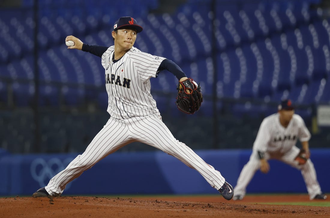 Aug 4, 2021; Yokohama, Japan; Team Japan pitcher Yoshinobu Yamamoto (17) throws a pitch against Korea in a baseball semifinal match during the Tokyo 2020 Olympic Summer Games at Yokohama Baseball Stadium. Mandatory Credit: Yukihito Taguchi-USA TODAY Sports