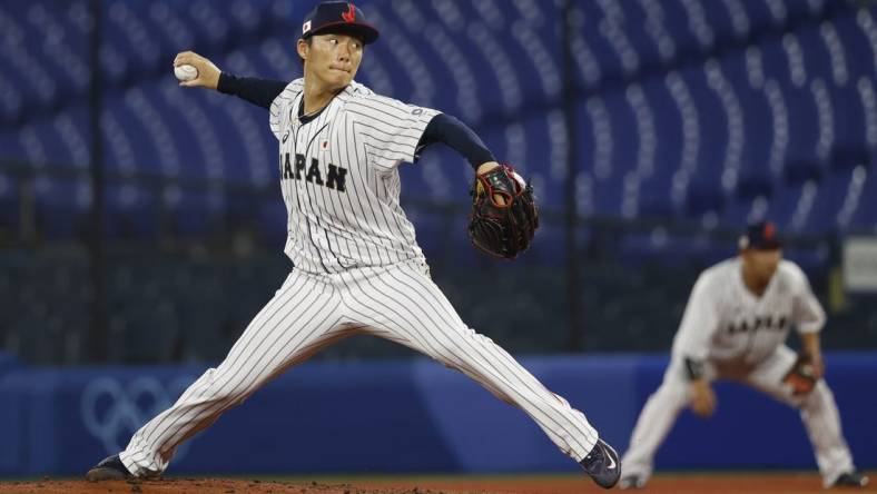 Aug 4, 2021; Yokohama, Japan; Team Japan pitcher Yoshinobu Yamamoto (17) throws a pitch against Korea in a baseball semifinal match during the Tokyo 2020 Olympic Summer Games at Yokohama Baseball Stadium. Mandatory Credit: Yukihito Taguchi-USA TODAY Sports