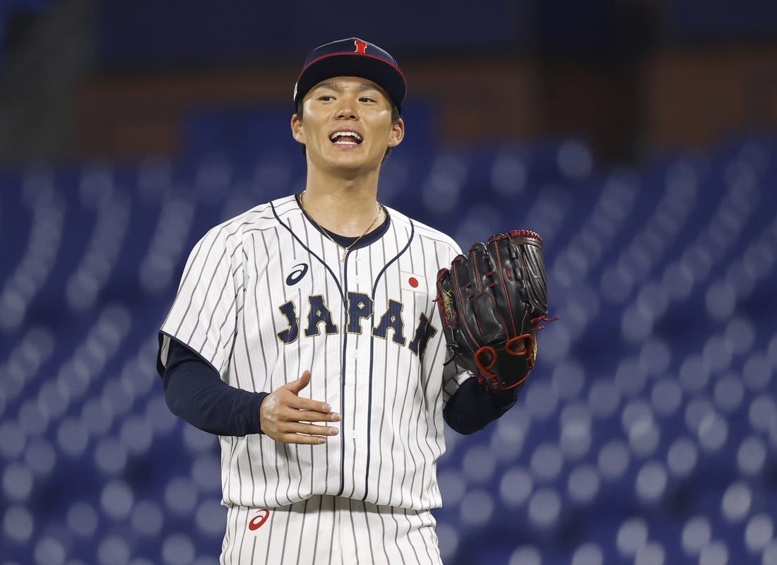 Aug 4, 2021; Yokohama, Japan; Team Japan pitcher Yoshinobu Yamamoto (17) reacts against Korea in a baseball semifinal match during the Tokyo 2020 Olympic Summer Games at Yokohama Baseball Stadium. Mandatory Credit: Yukihito Taguchi-USA TODAY Sports