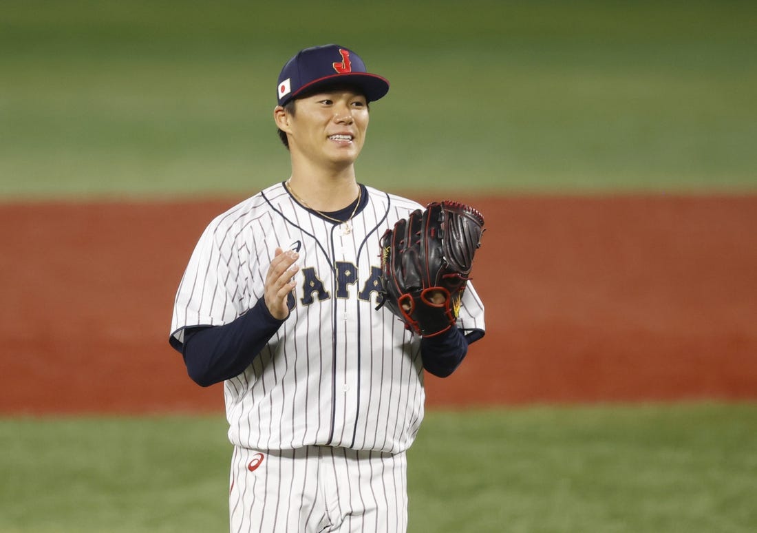 Aug 4, 2021; Yokohama, Japan; Team Japan pitcher Yoshinobu Yamamoto (17) reacts against Korea in a baseball semifinal match during the Tokyo 2020 Olympic Summer Games at Yokohama Baseball Stadium. Mandatory Credit: Yukihito Taguchi-USA TODAY Sports