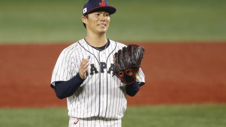 Aug 4, 2021; Yokohama, Japan; Team Japan pitcher Yoshinobu Yamamoto (17) reacts against Korea in a baseball semifinal match during the Tokyo 2020 Olympic Summer Games at Yokohama Baseball Stadium. Mandatory Credit: Yukihito Taguchi-USA TODAY Sports