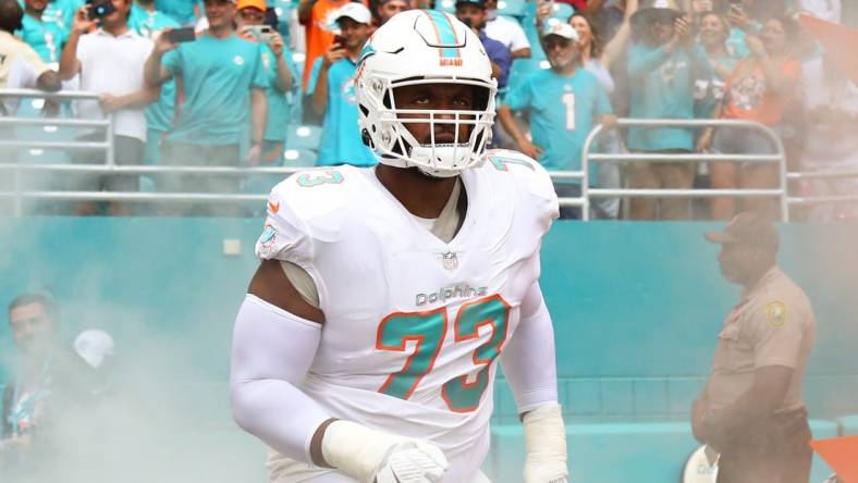 Oct 24, 2021; Miami Gardens, Florida, USA; Miami Dolphins offensive tackle Austin Jackson (73) takes on the field prior the game against the Atlanta Falcons at Hard Rock Stadium. Mandatory Credit: Sam Navarro-USA TODAY Sports