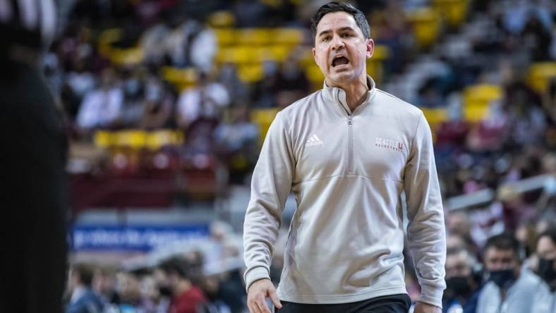 Seattle head coach Chris Victor talks to his players as the New Mexico State Aggies face off against the Seattle Red Hawks at the Pan American Center in Las Cruces on Saturday, Feb. 5, 2022.

Nmsu Su 23