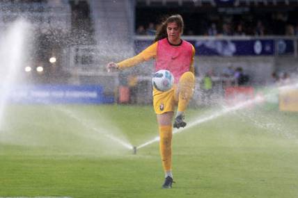 Jun 11, 2022; Louisville, Kentucky, USA;  Angel City FC goalkeeper Maia Perez (24) warms up during half time as the sprinkler system runs against Racing Louisville FC at Lynn Family Stadium. Mandatory Credit: EM Dash-USA TODAY Sports