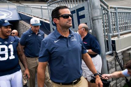 Penn State football defensive coordinator Manny Diaz walks onto the turf with other members of the team during football media day at Beaver Stadium on Saturday, August 6, 2022, in State College.

Hes Dr 080622 Psumedia