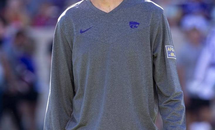 Sep 3, 2022; Manhattan, Kansas, USA; Kansas State Wildcats offensive coordinator Collin Klein watches the team warm up before the start of a game against the South Dakota Coyotes at Bill Snyder Family Football Stadium. Mandatory Credit: Scott Sewell-USA TODAY Sports