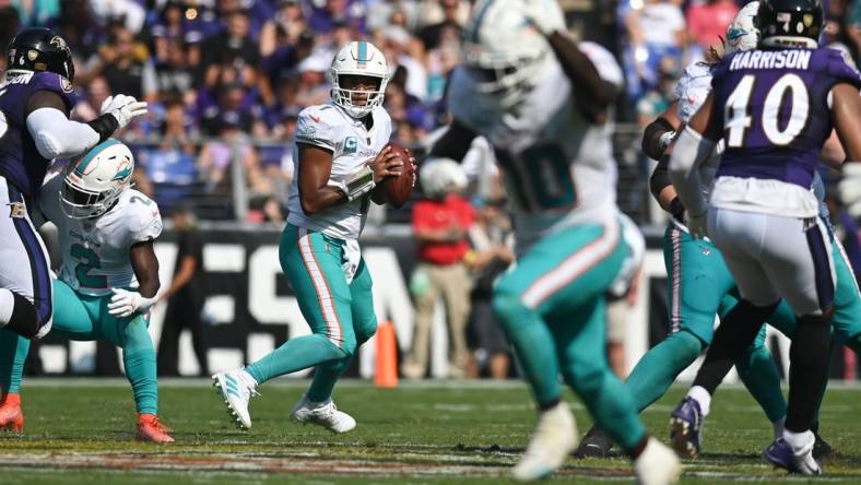 Miami Dolphins quarterback Tua Tagovailoa (1) looks to wide receiver Tyreek Hill (10) during the 2022 matchup with the Baltimore Ravens at M&T Bank Stadium. Mandatory Credit: Tommy Gilligan-USA TODAY Sports