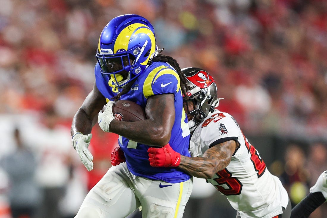 Nov 6, 2022; Tampa, Florida, USA;  Los Angeles Rams running back Darrell Henderson Jr. (27) is tackled by Tampa Bay Buccaneers cornerback Sean Murphy-Bunting (23) in the third quarter at Raymond James Stadium. Mandatory Credit: Nathan Ray Seebeck-USA TODAY Sports