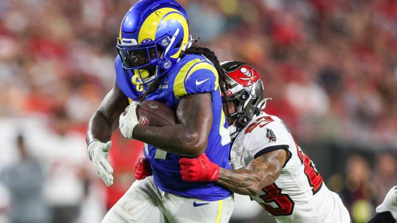 Nov 6, 2022; Tampa, Florida, USA;  Los Angeles Rams running back Darrell Henderson Jr. (27) is tackled by Tampa Bay Buccaneers cornerback Sean Murphy-Bunting (23) in the third quarter at Raymond James Stadium. Mandatory Credit: Nathan Ray Seebeck-USA TODAY Sports