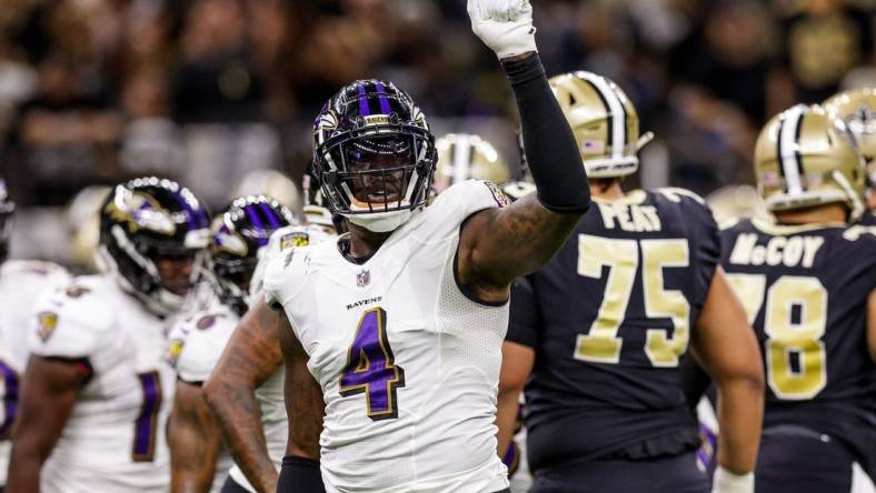 Nov 7, 2022; New Orleans, Louisiana, USA;  Baltimore Ravens linebacker Jason Pierre-Paul (4) signals a 4th down stop against the New Orleans Saints during the first half at Caesars Superdome. Mandatory Credit: Stephen Lew-USA TODAY Sports