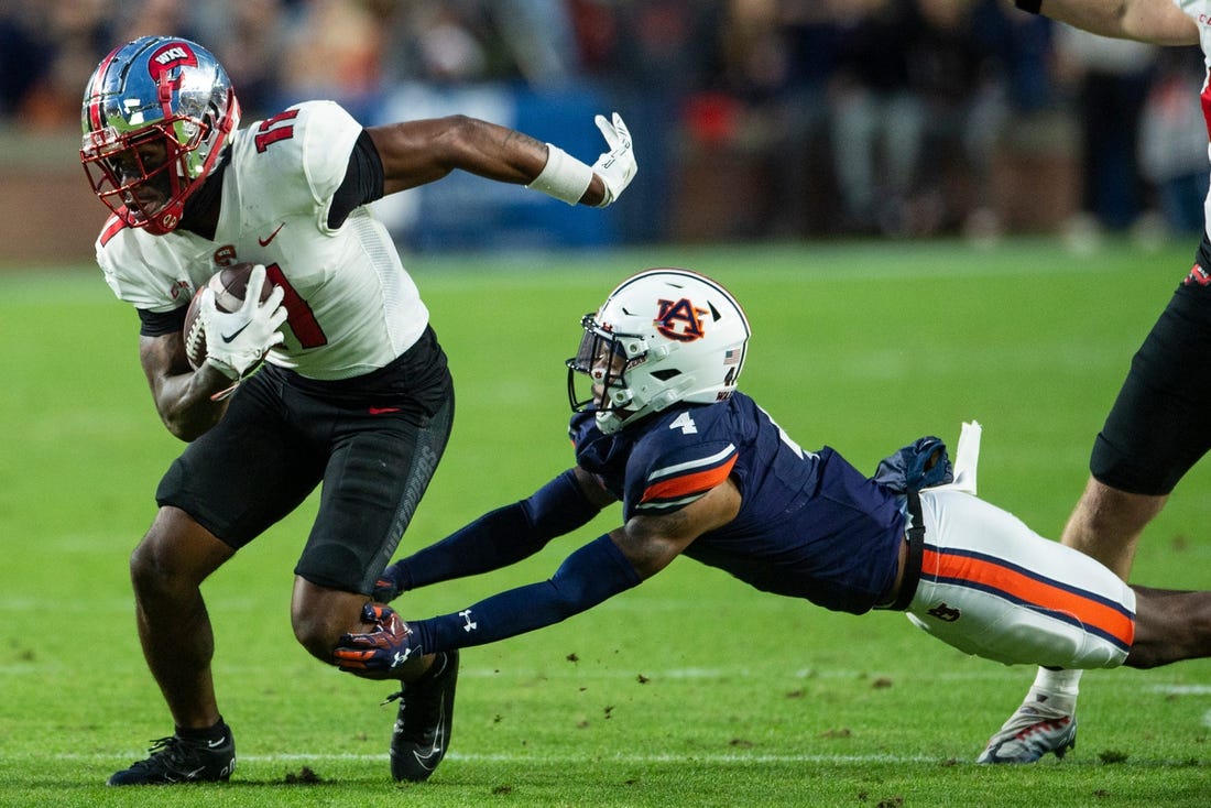 Western Kentucky Hilltoppers wide receiver Malachi Corley (11) turns up field after making a catch as Auburn Tigers take on Western Kentucky Hilltoppers at Jordan-Hare Stadium in Auburn, Ala., on Saturday, Nov. 19, 2022. Auburn Tigers and Western Kentucky Hilltoppers are tied 17-17 at halftime.