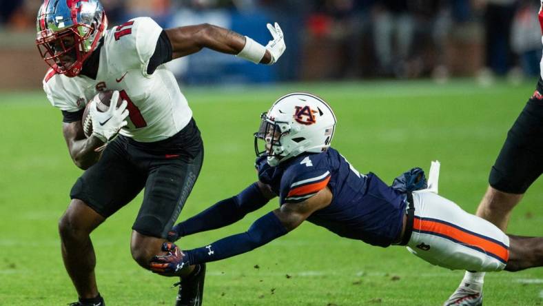 Western Kentucky Hilltoppers wide receiver Malachi Corley (11) turns up field after making a catch as Auburn Tigers take on Western Kentucky Hilltoppers at Jordan-Hare Stadium in Auburn, Ala., on Saturday, Nov. 19, 2022. Auburn Tigers and Western Kentucky Hilltoppers are tied 17-17 at halftime.