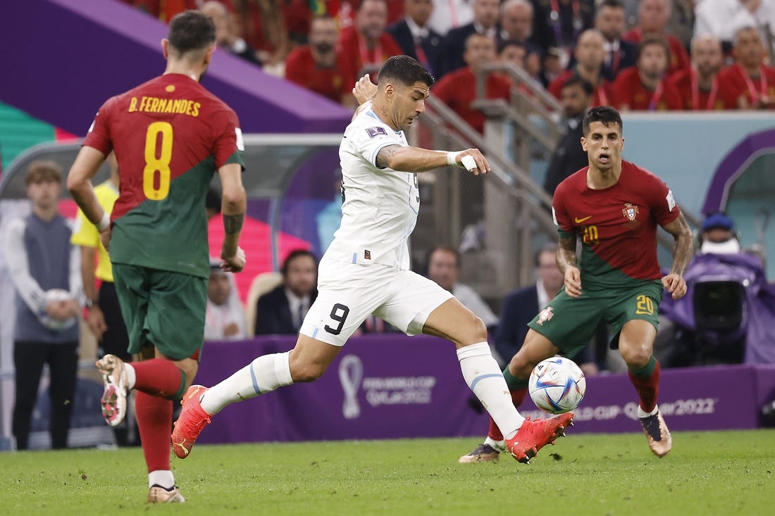 Nov 28, 2022; Lusail, Qatar; Uruguay forward Luis Suarez (9) shoots on goal against Portugal during the second half of the group stage match in the 2022 World Cup at Lusail Stadium. Mandatory Credit: Yukihito Taguchi-USA TODAY Sports