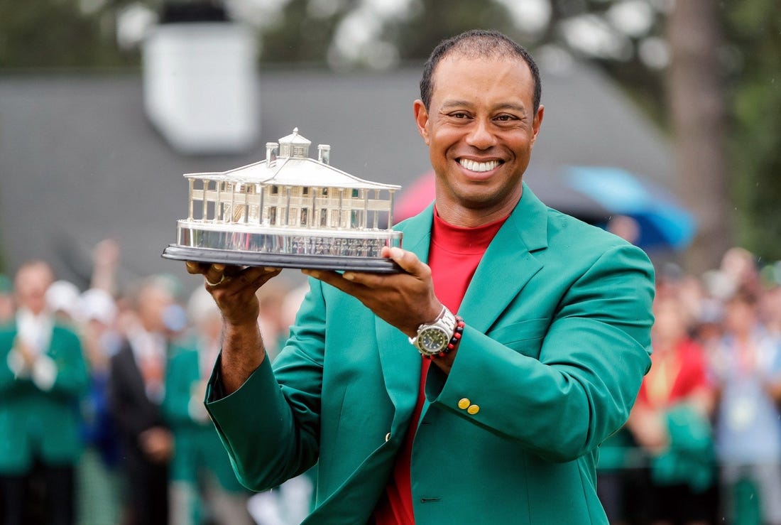 Tiger Woods celebrates during the trophy presentation after winning the Masters Tournament at Augusta National Golf Club, Sunday, April 14, 2019, in Augusta, Georgia. [ALLEN EYESTONE/FOR THE AUGUSTA CHRONICLE]