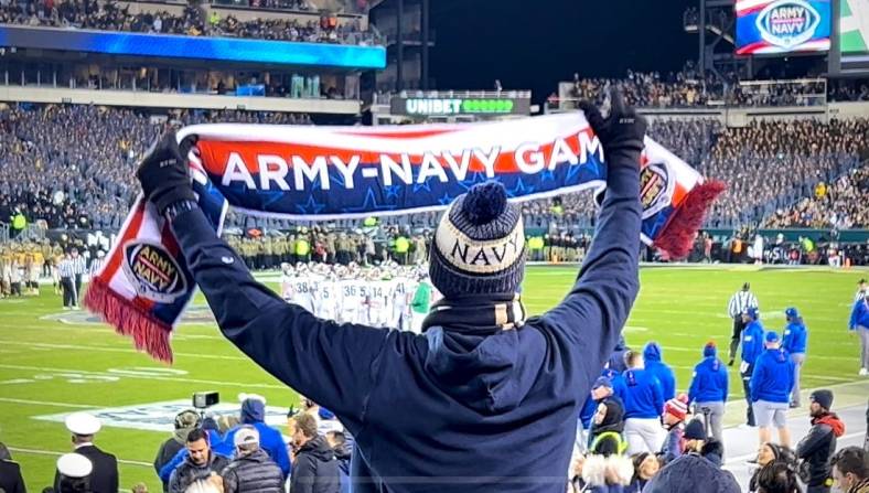 A Navy fan urges on the Midshipmen as the Army-Navy game goes to overtime for the first time in the rivalry's history. Army won 20-17 in the second overtime.

Img 2166