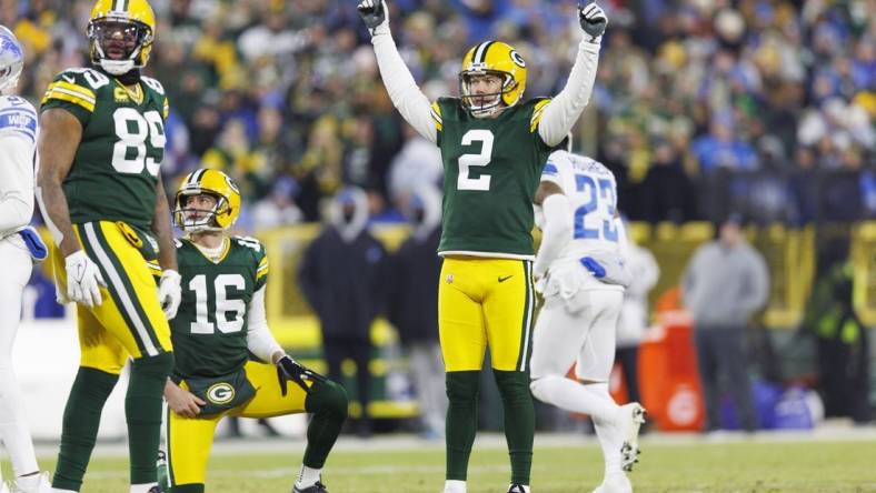 Jan 8, 2023; Green Bay, Wisconsin, USA;  Green Bay Packers kicker Mason Crosby (2) celebrates after making a a field goal during the second quarter against the Detroit Lions at Lambeau Field. Mandatory Credit: Jeff Hanisch-USA TODAY Sports