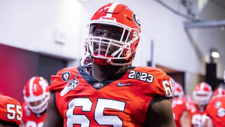 Jan 9, 2023; Inglewood, CA, USA; Georgia Bulldogs offensive lineman Amarius Mims (65) against the TCU Horned Frogs during the CFP national championship game at SoFi Stadium. Mandatory Credit: Mark J. Rebilas-USA TODAY Sports