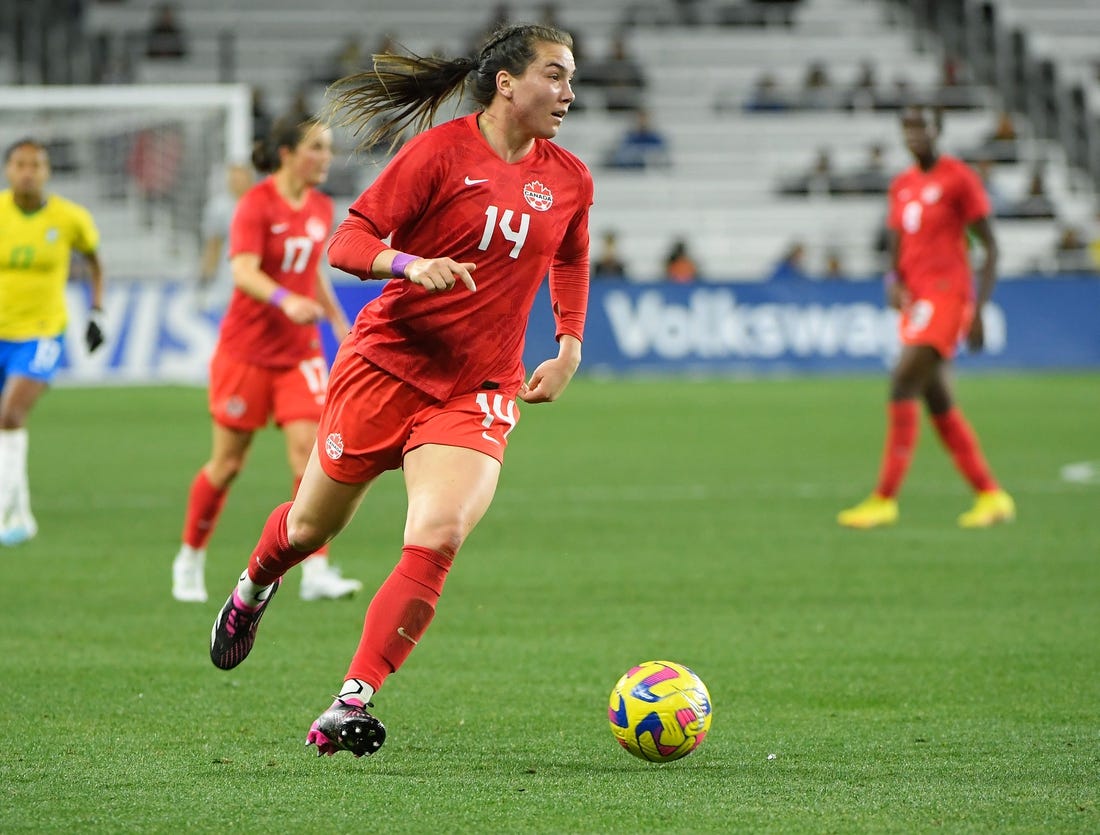 Feb 19, 2023; Nashville, Tennessee, USA;  Canada defender Vanessa Gilles (14) dribbles the ball against Canada during the first half at Geodis Park. Mandatory Credit: Steve Roberts-USA TODAY Sports