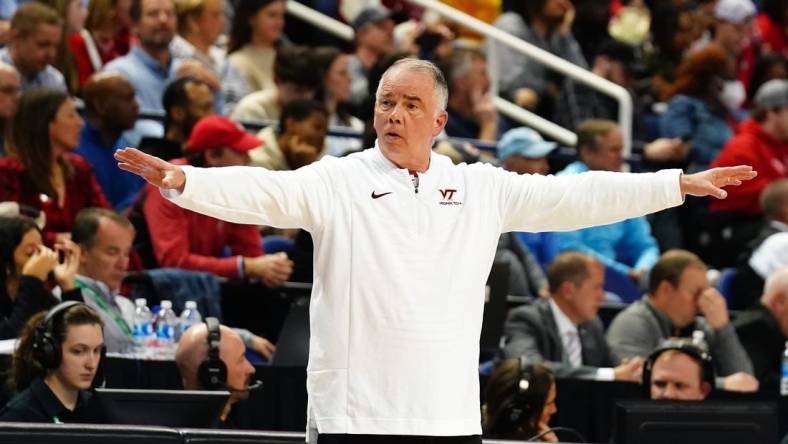 Mar 8, 2023; Greensboro, NC, USA; Virginia Tech Hokies head coach Mike Young signal to his players against the North Carolina State Wolfpack during the first half of the second round of the ACC tournament at Greensboro Coliseum. Mandatory Credit: John David Mercer-USA TODAY Sports