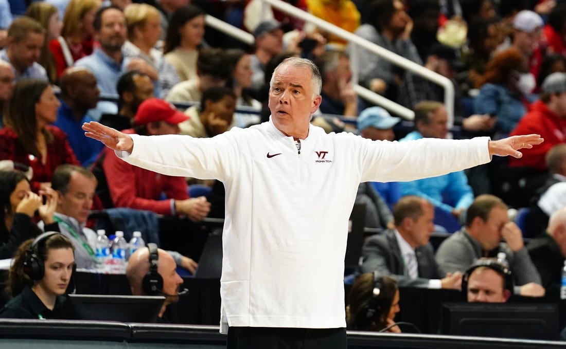 Mar 8, 2023; Greensboro, NC, USA; Virginia Tech Hokies head coach Mike Young signal to his players against the North Carolina State Wolfpack during the first half of the second round of the ACC tournament at Greensboro Coliseum. Mandatory Credit: John David Mercer-USA TODAY Sports