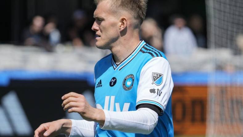 Mar 11, 2023; Charlotte, North Carolina, USA; Charlotte FC forward Karol Swiderski (11) wears the Apple logo on his kit during the first half against the Atlanta United at Bank of America Stadium. Mandatory Credit: Jim Dedmon-USA TODAY Sports