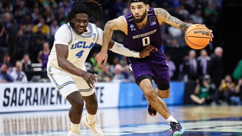 Mar 18, 2023; Sacramento, CA, USA; Northwestern Wildcats guard Boo Buie (0) drives to the basket while defended by UCLA Bruins guard Will McClendon (4) during the second half at Golden 1 Center. Mandatory Credit: Kelley L Cox-USA TODAY Sports