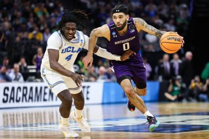 Mar 18, 2023; Sacramento, CA, USA; Northwestern Wildcats guard Boo Buie (0) drives to the basket while defended by UCLA Bruins guard Will McClendon (4) during the second half at Golden 1 Center. Mandatory Credit: Kelley L Cox-USA TODAY Sports