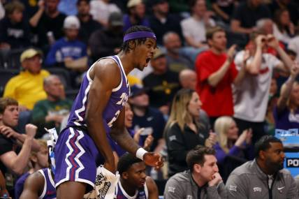 Mar 19, 2023; Denver, CO, USA; TCU Horned Frogs forward Emanuel Miller (2) celebrates on the bench in the first half against the Gonzaga Bulldogs at Ball Arena. Mandatory Credit: Michael Ciaglo-USA TODAY Sports