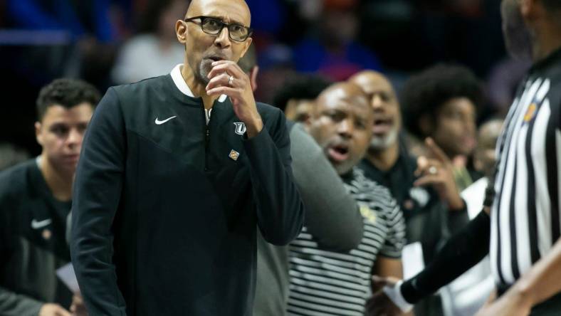 UCF Knights head coach Johnny Dawkins talks to the referee during the first half of the NIT tournament Wednesday, March 15, 2023, at Exactech Arena in Gainesville, Fla. Alan Youngblood/Gainesville Sun

Gai Ufucf3takeaways 27785370