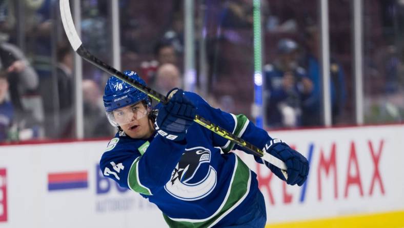 Apr 2, 2023; Vancouver, British Columbia, CAN; Vancouver Canucks defenseman Ethan Bear (74) shoots during warm up prior to a game against the Los Angeles Kings at Rogers Arena. Mandatory Credit: Bob Frid-USA TODAY Sports