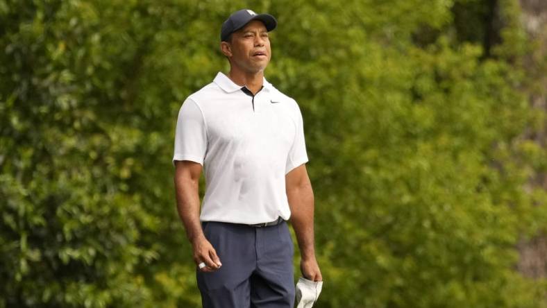 Apr 6, 2023; Augusta, Georgia, USA; Tiger Woods watches his shot on the second fairway during the first round of The Masters golf tournament. Mandatory Credit: Michael Madrid-USA TODAY Network