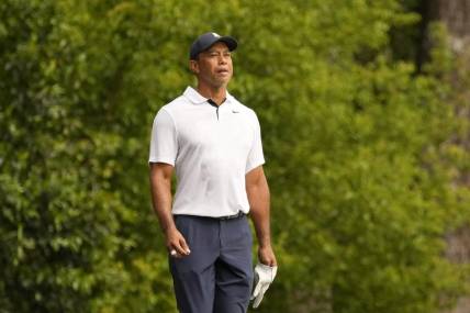 Apr 6, 2023; Augusta, Georgia, USA; Tiger Woods watches his shot on the second fairway during the first round of The Masters golf tournament. Mandatory Credit: Michael Madrid-USA TODAY Network