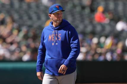 Apr 16, 2023; Oakland, California, USA; New York Mets pitching coach Jeremy Hefner walks to the dugout during the eighth inning against the Oakland Athletics at RingCentral Coliseum. Mandatory Credit: Darren Yamashita-USA TODAY Sports