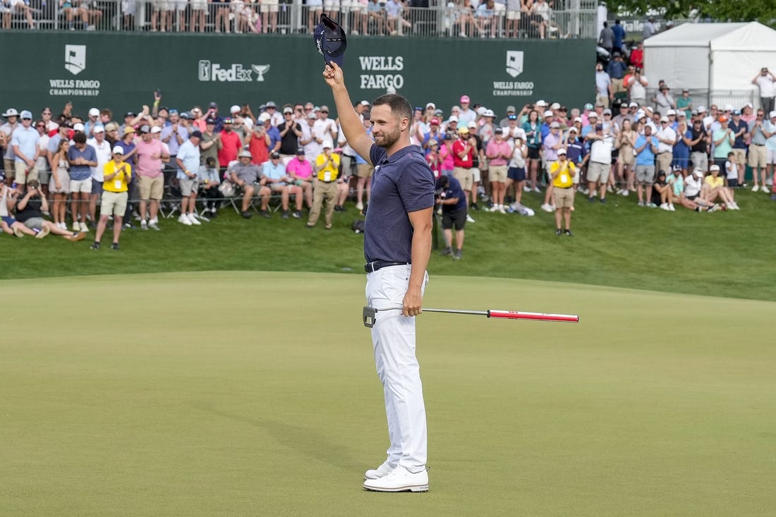 May 7, 2023; Charlotte, North Carolina, USA; Wyndham Clark celebrates to the gallery after his win during the final round of the Wells Fargo Championship golf tournament. Mandatory Credit: Jim Dedmon-USA TODAY Sports