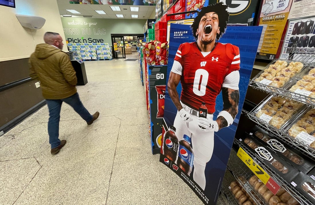 A promotional  display for Pepsi featuring Wisconsin running back Braelon Allen is shown in November 2022 at a Pick 'n Save store in Fond du Lac, Wis. When the NCAA enacted Name Image Likeness (NIL) legislation in July 2021 it gave athletes the opportunity to earn money off endorsements as well as use their name in support of causes important to them.